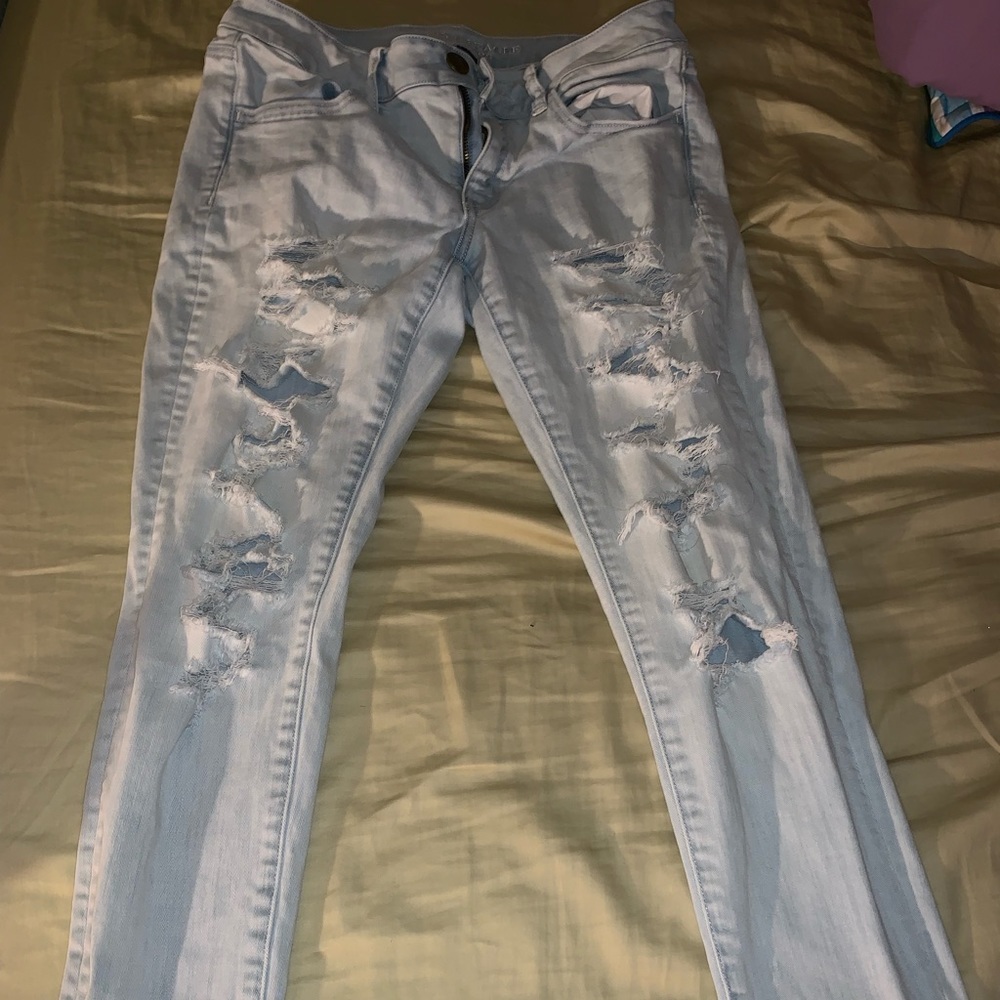 Light wash distressed denim jeans